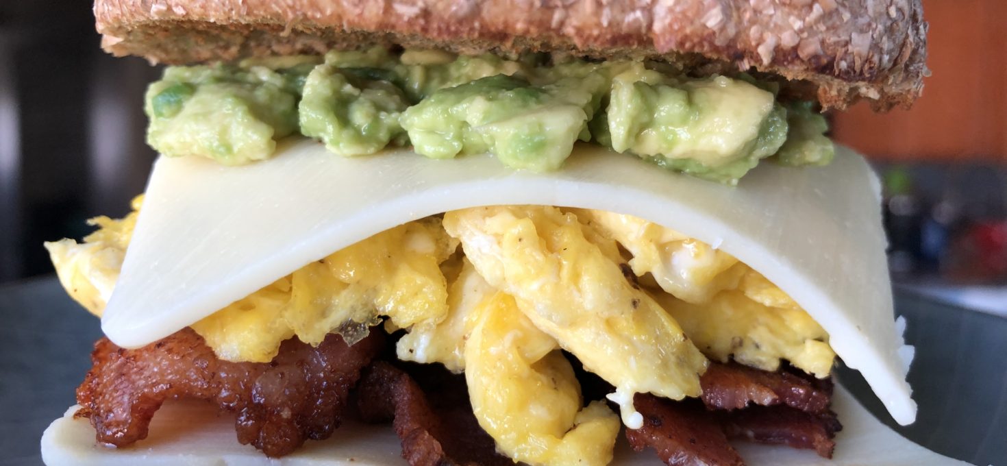 Bacon & Egg Bagel Sandwich with Avo & Chipotle Aioli